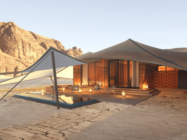 Luxury desert tent with a private pool, surrounded by scenic rock formations in AlUla, Saudi Arabia.