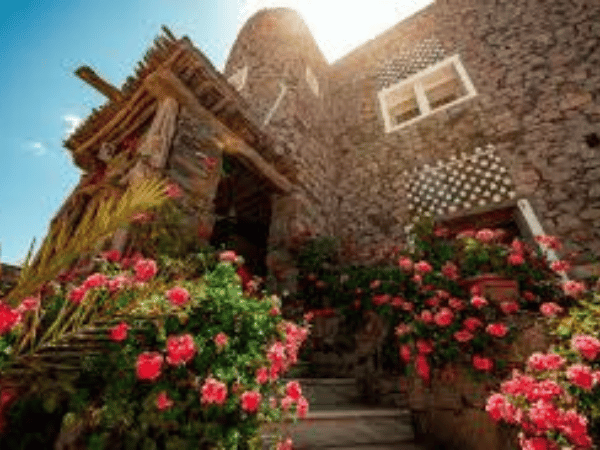 Traditional stone house with blooming flowers