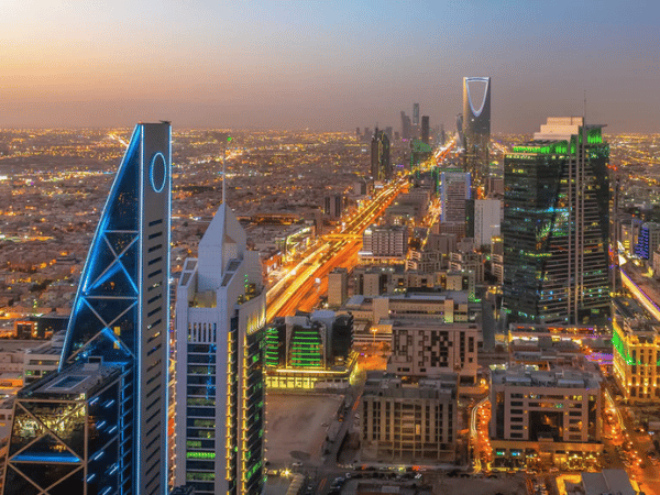 A stunning aerial view of the illuminated skyline of Riyadh, Saudi Arabia, at dusk