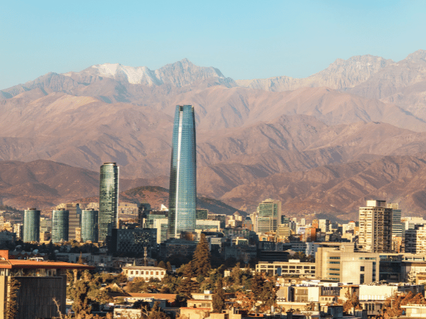 Aerial view of Santiago skyline at sunset with Andes Mountains in the background – DMC Chile
