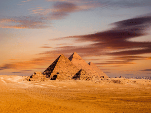 Sunset view of the Giza pyramid complex, a stunning landmark for tours and events with a DMC in Egypt.