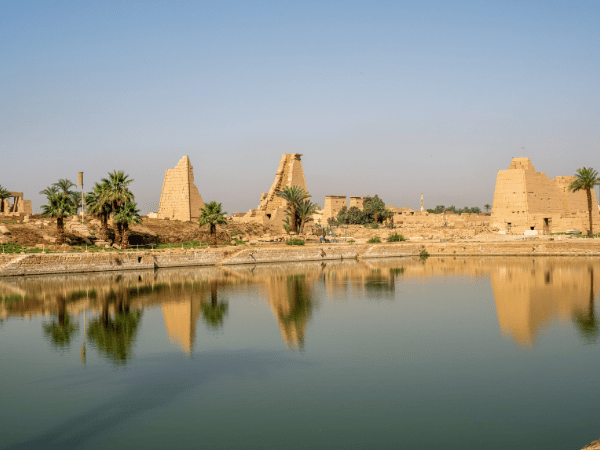 The Sacred Lake of the Karnak Temple in Luxor, a historical site included in tours by a DMC in Egypt.