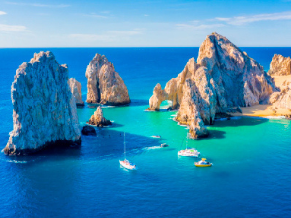 Cabo San Lucas, Mexico The famous Arch, a natural rock formation and popular landmark, with boats sailing nearby.