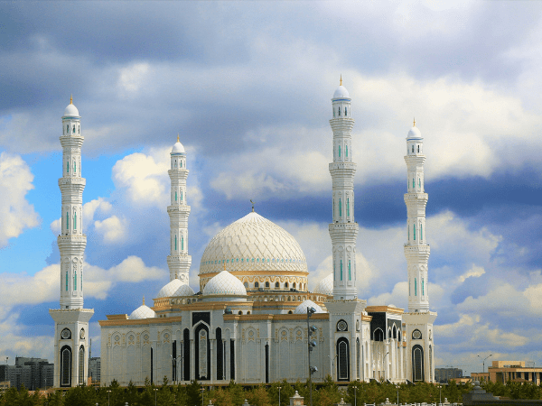 White mosque with blue dome and minarets, Hazrat Sultan Mosque, Astana, Kazakhstan.