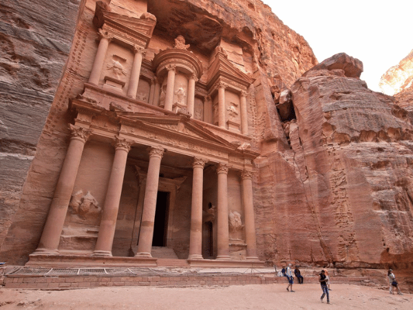 Tourists at Petra's Al-Khazneh, an ancient sandstone-carved facade in Jordan