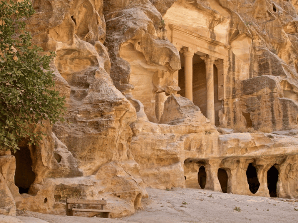 Carved sandstone caves and facades at the ancient city of Petra, Jordan